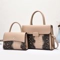 Close-up of beige faux leather handbag set with snakeskin texture and gold hardware details - Khaki