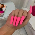 Long ballerina press-on nails in bright pink color shown on a hand with ELLE magazine - Hot Pink