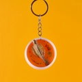 Realistische vis-sleutelhanger in transparante oranje hars met metalen ketting - Brasem