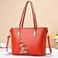Elegant red tote bag with white floral embroidery and gold hardware for women - Red