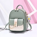 Stylish bean green and off-white PU leather backpack with quilted pattern and daisy charm - Green