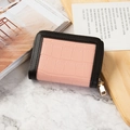 Pink crocodile embossed card holder with black leather trim and gold metal zipper detail - Pink