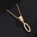 Close-up of golden oval pendant necklace with shimmering micro-pave cubic zirconia stones - Letter O