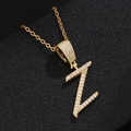 Macro shot of gold-plated Z-letter pendant with pavé zircon stones on black leather - Letter Z