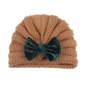 Knitted baby turban hat in brown featuring a contrasting dark green velvet bow detail - Coffee
