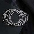 Detailed top view of 1.7mm stainless steel wire bracelets on a textured black background - Steel Color