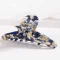 Macro detail of large marble acetate hair claw clip with blue and yellow patterns - S138-9 Blue Yellow White Mix