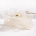 Close-up of cream white acetate hair claw clip showing glossy finish and gold metal spring - S141-2 Glossy Cream
