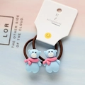 Detail of blue bear charms on brown elastic hair ties with festive pink scarf details - Scarf Bear