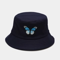 Close-up of fine butterfly embroidery and cotton twill texture on a navy blue bucket hat - Navy Blue