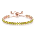 Detailed macro view of rose gold adjustable slider buckle and emerald green zirconia crystals - Rose Gold + Topaz Yellow Zirconia