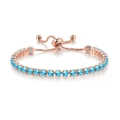 Detail of rose gold tennis bracelet with 4mm blue round cubic zirconia and bolo slider clasp - Rose Gold - Sea Blue