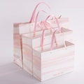 Pink marble gift bags with ribbon handles and metal rivets in three different sizes - Pink Marble Rivet Style