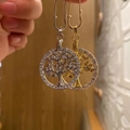 Detailed close-up of Tree of Life pendant with white crystals in gold and silver finish - Christmas Tree Pin