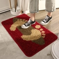 Durable red doormat with beige footprint pattern for entryways and bathrooms - Footprint