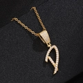 Macro detail of 18K gold letter D pendant necklace featuring sparkling white zircon pave - Letter D