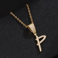 Macro shot of gold-plated letter P pendant necklace with sparkling pavé zircons - Letter P