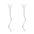 Detailed macro shot of silver butterfly drop earrings with elegant wavy long tassels - 925 Silver / Butterfly Style