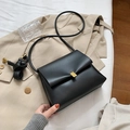Minimalist black faux leather crossbody bag with elegant gold metal buckle closure - Black