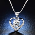 Macro view of heart-shaped S925 sterling silver necklace with large round-cut moissanite - Q019 Heart S925 1ct
