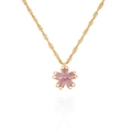 Close-up of pink cherry blossom pendant with crystal center on a gold chain - Purple