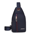 Detail of navy blue nylon chest bag featuring adjustable strap and red decorative zipper trim - Blue 03