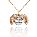 Detail of rose gold sunflower necklace opening to reveal You Are My Sunshine message - DIY Engraving / Rose Gold