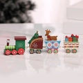 Detail of wooden Christmas train with festive figurines and reflections on a white surface - Y01222 4-Section / Colorful