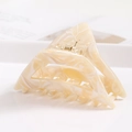 Macro detail of acetate hair claw clip featuring beige marble texture and gold spring - S140-3 Triangle Beige Marble