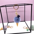 Cute plush ice cream keychain with colorful faux fur pompom and golden heart charm - Blue