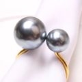 Elegant gold U-shaped napkin ring featuring two grey pearls on a white linen napkin - Color Preserving Gold Grey High Lustre Pearl
