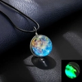 Macro detail of cosmic glass sphere pendant showing vibrant glow-in-the-dark luminous effect - Luminous Style 14