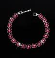 Silver bracelet with red cubic zirconia flower charms and a secure folding clasp - 17.6cm / Red