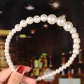 Detail of elegant white woven pearl headband with gradient beads on a blurred background - 19# Gradient Faux Pearls