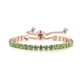 Close-up of rose gold tennis bracelet with green zircon stones and adjustable bolo clasp - Rose Gold + Peridot Zirconia