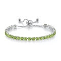 Detail of adjustable silver tennis bracelet with round olive green stones and bolo clasp - White Gold + Peridot Zirconia