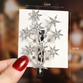 Close-up of a sparkling rhinestone star hair clip with 5.5cm width and 8.5cm height - S192-2 Radiant Star Hair Clip