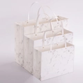 Three-piece set of white marble pattern gift bags with sturdy metal rivet handles - Grey Marble Rivet Style