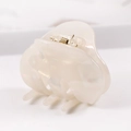 Macro detail of elegant pearlescent acetate hair claw with durable gold metal spring - S136-2 Bow Pearly White