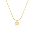 Detail of letter M pendant with sparkling clear crystals on a gold snake chain necklace - Letter M