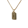 Detail of a gold-plated rectangular pendant necklace featuring an embossed letter I - Letter I