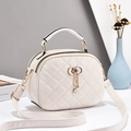 Chic beige quilted crossbody handbag with gold butterfly bow and rhinestone tassel decor - Off White