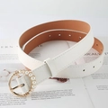 White faux leather belt for women featuring a gold round buckle with pearl embellishments - White