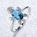 Elegant turtle ring with oval blue sapphire and silver band in minimalist marine style - Blue-Green Gradient Zirconia