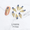 Macro detail of LF6856 gold alloy 3D nail art charms with blue teardrop rhinestones - Gold Deep Blue Gem Style (6856)