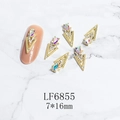 Macro detail of 7x16mm 3D gold alloy nail charms with AB rhinestones on marble background - Gold AB Phantom Gem Style (6855)