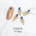 Macro view of 7x16mm gold alloy nail art charm with blue teardrop stone and tiny crystals - Gold Blue Gem Style (6870)