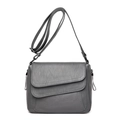 Deep grey mini crossbody bag with double flap design and adjustable leather strap - Light Gray