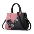 Pink and black patchwork handbag with floral embroidery and a plush pompom charm - Color Block Light Pink