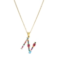 Close-up of golden letter N necklace pendant with colorful inlaid gemstones detail - Letter N